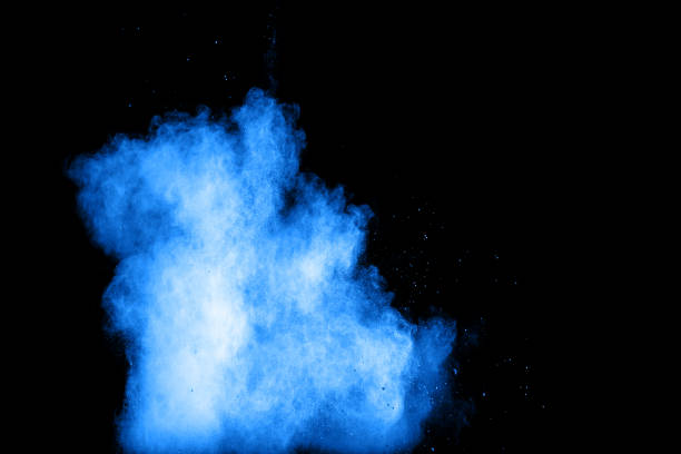 istock abstract blue dust explosion on  black background ,abstract blue powder splattered on black background , Freeze motion of blue powder exploding. 943452624