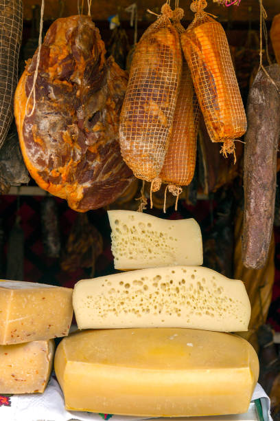 Various types of romanian chesses and sausages, smoked and dried, exposed for sale at one traditional fair. Specific for Maramures area, Romania.