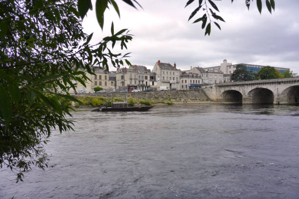 View of the Henri IV bridge at Châtellerault from the Vienne View of the Vienne River and the Henri IV Bridge in Châtellerault, Cognet Island and Cordeliers Islet. chatellerault photos stock pictures, royalty-free photos & images