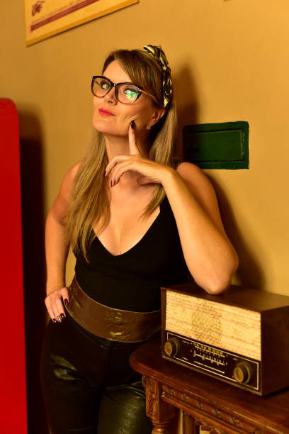 istock Woman and Old Radio 943457188