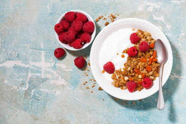 istock granola with dried apricots, raspberries and yogurt for breakfast 943460506