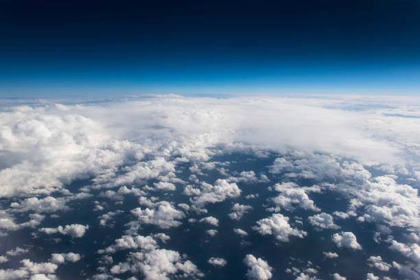 istock Beautiful view from window of airplane in blue sky 943468710