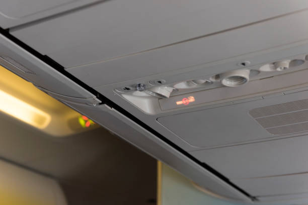 istock No Smoking Sign inside an airplane. Overhead console in the passenger aircraft 943468944