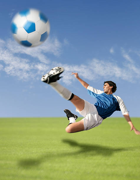 istock Flying soccer player hitting the ball 94347145
