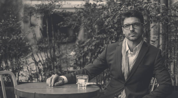 istock Man sitting in coffee shop and drinking coffee 943474960