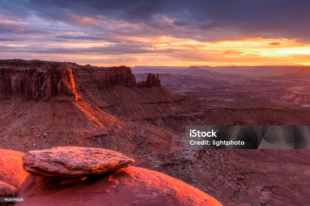 Junction Butte and Grand Viewpoint Sunset The setting sun lights up Junction Butte and the Island in the Sky in Canyonlands National Park, Utah. Boulder - Rock Stock Photo