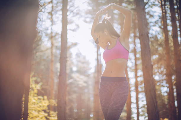 istock Fit girl training in forest 943483440
