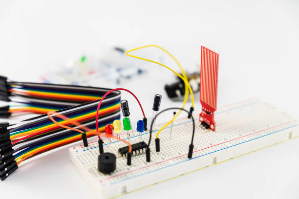 istock Microcontrollers, chips, resistors and light-emitting diodes on white desktop of hardware engineer. Engineer workplace 943483688