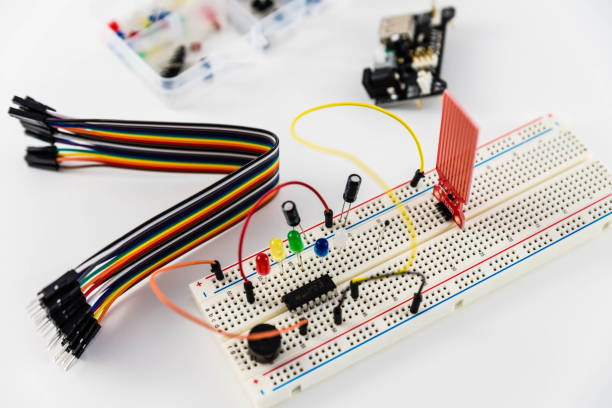 istock Microcontrollers, chips, resistors and light-emitting diodes on white desktop of hardware engineer. Engineer workplace 943483696