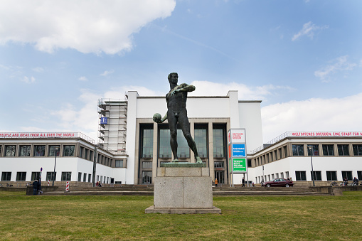 Dresden, Germany - April 2, 2018: Copper Statue Ball Launcher by Richard Daniel Fabricius from 1907 in front of the German Hygiene Museum on April 2, 2018 in Dresden, Germany.