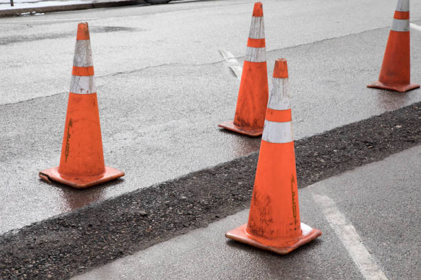 istock Asphalt patch in a road from utility maintenance 943488424
