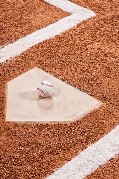 istock Looking down on a new baseball sitting on home plate 943489062