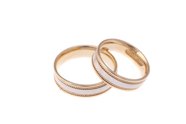 istock Golden wedding rings, isolated on white 943492028