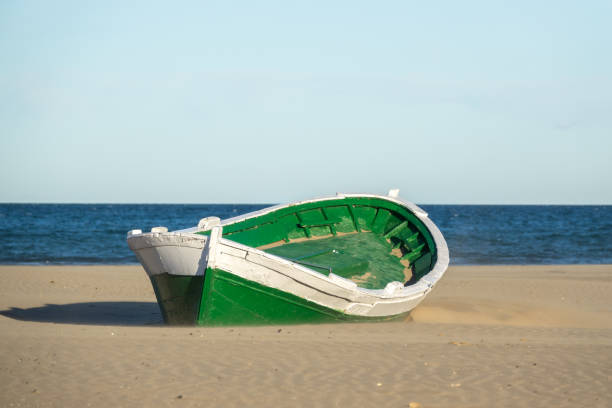 istock Malvarrosa Valencia Spain, Wrecked wooden boat 943495084