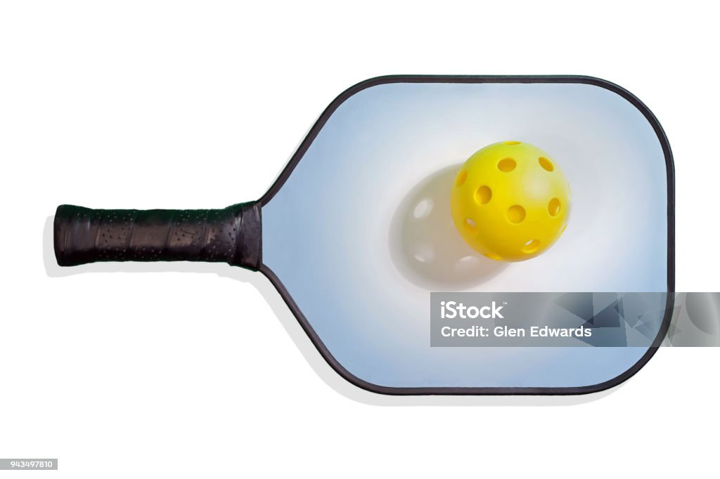 Pickleball Paddle with Yellow Pickleball Colored Pickleball paddle with black handle and border and yellow ball with spotlight shadow. Pickleball Stock Photo