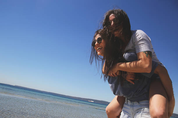 istock Young friends enjoying their summer vacation on beach 943499222