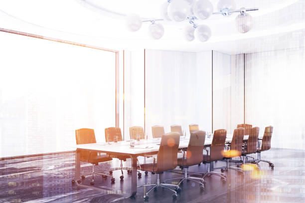 istock Panoramic white meeting room, black table toned 943501894