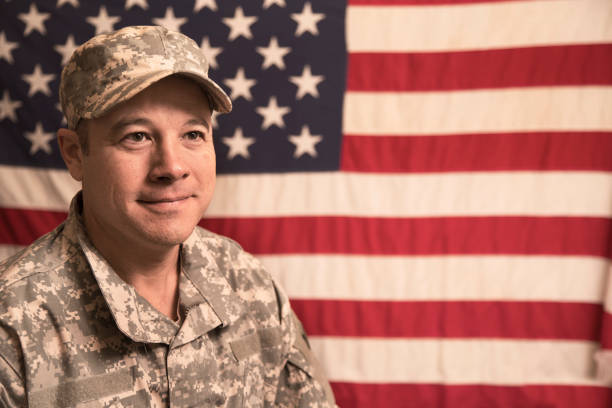 istock USA armed forces military man with American flag. 943506300