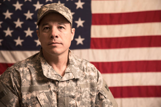 istock USA armed forces military man with American flag. 943506392