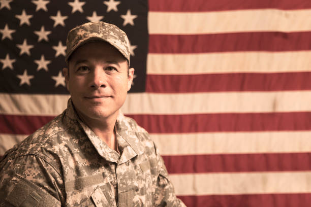 istock USA armed forces military man with American flag. 943506420