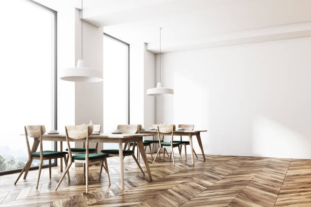 istock Modern white cafe corner, green chairs 943512916