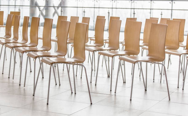 istock Rows of chairs - meeting background 943525920