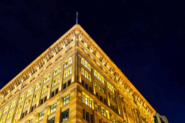 istock Illuminating old office building against night sky, Australia, copy space 943532174