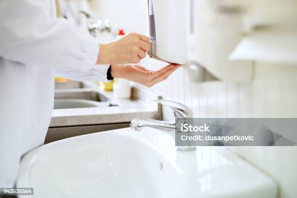 Close Up View Of A Worker In Sterile Cloths Washing Hands A Bathroom Before Working Stock Photo - Download Image Now