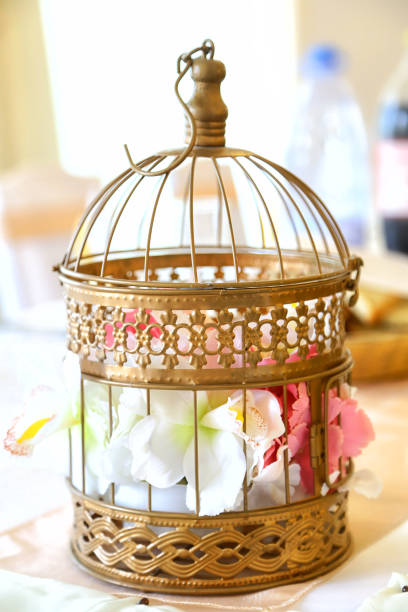 istock Wedding decoration. Flower in a decorative cage. 943542234