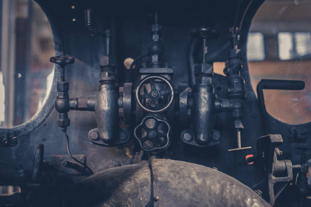 istock vintage technology - valves and handles inside old machine 943542548