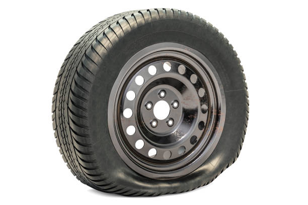 Punctured car wheel, flat tire. 3D rendering isolated on white background Punctured car wheel, flat tire. 3D rendering isolated on white background flat tire stock pictures, royalty-free photos & images