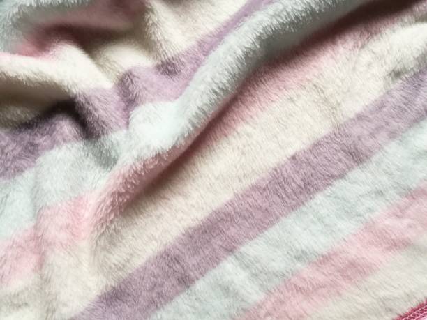 istock fur, feather and wool fabric texture background,crumpled fabric background. 943551664