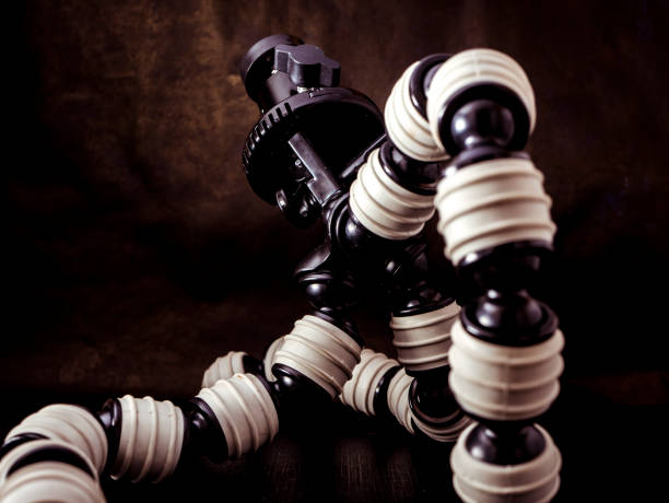 close up flexible tripod for camera on black background