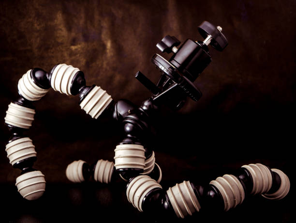 close up flexible tripod for camera on black background