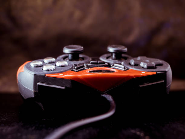 istock red and black game joystick close up shot 943564172