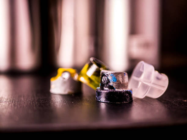 istock aerosole spray paint caps and cans on black surface 943564286