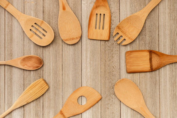 istock Collection of wooden kitchen utensils on rustic background with copy space 943566930