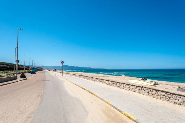 istock Desert road near sardinian beach 943570792