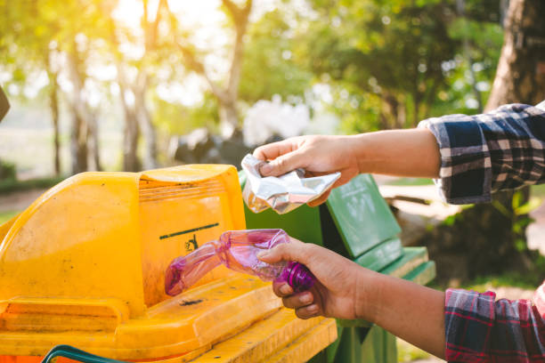 istock Child volunteer help garbage collection charity environment. 943584730