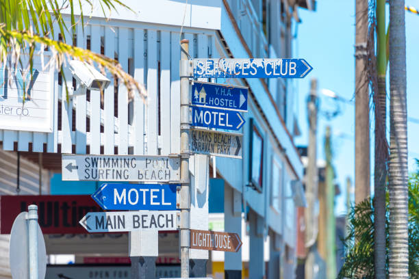 Touristic guidance directional signs on pole in Byron Bay, NSW, Australia Byron Bay, NSW, Australia- January 3, 2018: Touristic guidance directional signs on pole in Byron Bay, a paradise with gorgeous beaches and coastal trails on the North Coast of NSW, Australia. byron bay stock pictures, royalty-free photos & images