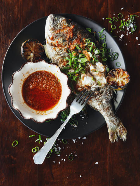 istock Barbecued whole snapper with sauce 943598228