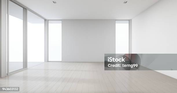 Piso De Madera Con Fondo De Pared Concreto Gris En Habitación En Casa Moderna Nueva Para Familia Grande Ventana De Cristal Y Puerta De Oficina Blanco Vacío O Estudio De Luz Natural Foto de stock y más banco de imágenes de Vacío