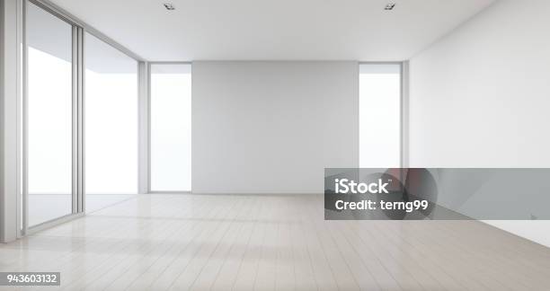 Wooden Floor With Gray Concrete Wall Background In Large Room At Modern New House For Big Family Glass Window And Door Of Empty White Office Or Natural Light Studio Stock Photo - Download Image Now