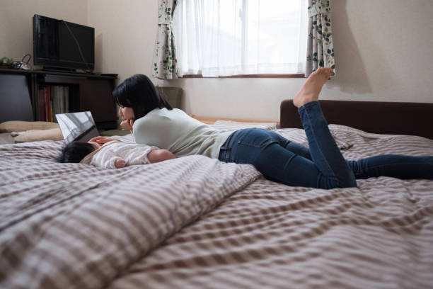 istock Mother working from home with baby 943605458