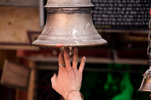 Image of hanging ringing bell in temple gate