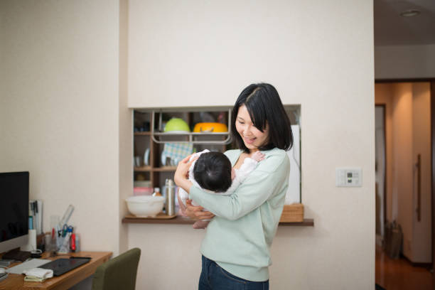 istock Mother embracing baby 943606040