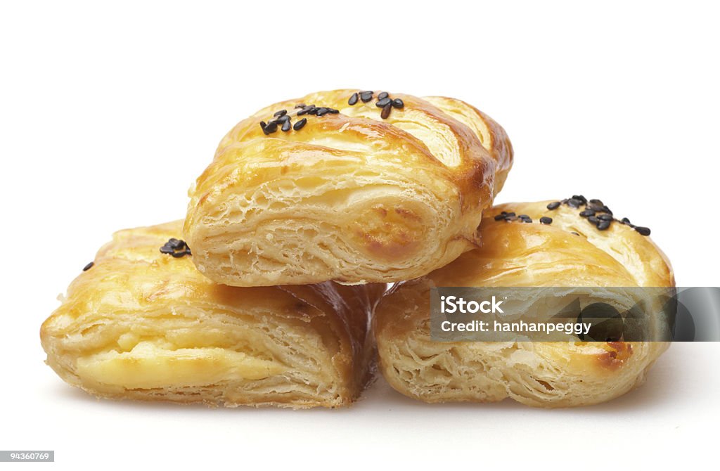 Three French pastries with chocolate toppings French breakfast pastry filled white peanut butter, isolated on white background. Brioche Stock Photo