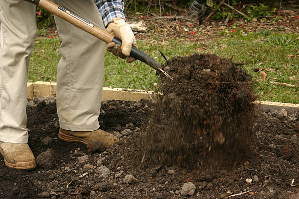 istock Gardener Tossing Soil with Garden Fork 94361236
