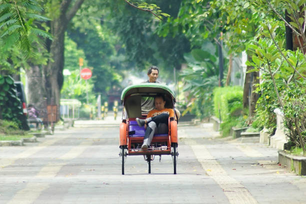 Traditional Rickshaw Surakarta, April 2018 - Becak, Traditional Transportation at Solo City yogyakarta stock pictures, royalty-free photos & images