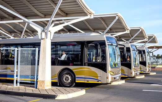 Pretoria, South Africa - March 6, 2018: Public busses waiting in depot. The bus network is know as the Gautrain.